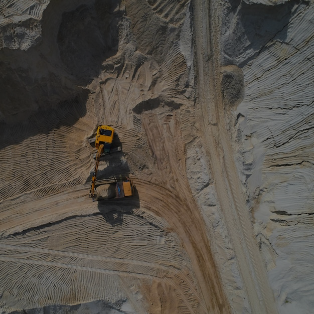 aerial view sand quarry with bulldozer